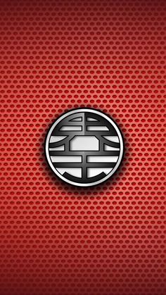 the emblem on a red wallpaper with black and white circles in it's center