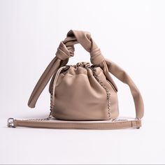 Treslux Khaki Drawstring Handbag This Unique Pleated Drawstring Bucket Handbag Features A Detachable Silver Chain That Can Be Transformed Into A Handbag And/Or Crossbody Bag. This Bag Is A Go To Bag For Casual And Daily Use. Fits All Essentials - Phone, Wallet, Keys, Makeup And More! Detailed Features: Pu Leather Signature Adjustable Treslux Pu Leather Chain Scrunch Handle Size: L:9 W:7 H:2.5in Luxury Spring Bucket Bag With Detachable Handle, Chic Beige Bag With Long Strap, Versatile Beige Soft Leather Bucket Bag, Casual Beige Soft Leather Bucket Bag, Beige Casual Bucket Bag With Soft Leather, Versatile Beige Bucket Bag With Adjustable Strap, Chic Light Brown Bucket Bag With Adjustable Strap, Beige Pouch Bag For Day Out, Light Brown Bag With Adjustable Strap For Day Out