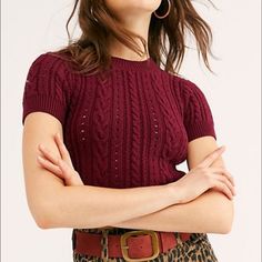 Free People Short + Sweet Cropped Sweater Nwt Color: Plum Size: S Wear It Alone Or Layer It, Either Way. This Sweater Is So Soft And Stretchy, Featuring A Cropped Silhouette, A Scoop Neck, And Short Sleeve Detail. Fitted Style Stretch Knit Fabrication Wide Ribbed Hems 38% Acrylic 4% Polyamide 57% Cotton 1% Elastane Fitted Cable Knit Cropped Tops, Fitted Cable Knit Short Sleeve Tops, Fitted Short Sleeve Cable Knit Tops, Chic Short Sleeve Cable Knit Tops, Fall Cable Knit Short Sleeve Tops, Fitted Burgundy Knit Tops, Retro Cable Knit Tops For Fall, Free People Short, Stretchy Crop Tops