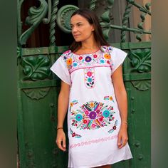 A Favorite Mexican Dress For Generations! Great For Weddings, Baby Showers, Bridal Showers, And Many Other Mexican Themed Events! New, Handmade Midi Dress, Floral Embroidery Made By Hand 100% By Native Artisans From Puebla, Mexico. Made With Poplin Fabric And Multicolor Cotros Threads. The Photos Are A Representation Of The Item You’ll Receive Not The Exact Same One, The Embroidery Patterns And Colors Will Be Always Different, Every Dress Is One Of A Kind. Fitted White Festival Dress, White Fitted Dress For Festival, White Summer Fiesta Dress, White Spring Fiesta Dress, White Dress For Spring Fiesta, White Bohemian Short Sleeve Dresses, White Dress With Floral Embroidery For Fiesta, White Short Sleeve Dress For Festival, White Floral Embroidery Dress For Fiesta