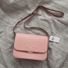 New Coach Brynn Flap Crossbody C5632 Gold/Shell Pink $350 Crossgrain Leather Inside Zip Pocket Buckle Closure, Fabric Lining Outside Zip And Open Pockets Adjustable Strap With 21 1/2" Drop For Shoulder Or Crossbody Wear 9 3/4" (L) X 7" (H) X 3 1/4" (W) Pink Cute Purse, Coach Purses For Teens, Elegant Spring Bags With Branded Hardware, Feminine Bags With Branded Hardware, Classic Blush Evening Bag, Pink Coach Purses, Sling Bags Women, Vintage Leather Handbag, Dream Bags