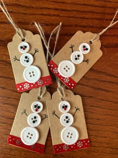 three tags with buttons and snowmen on them