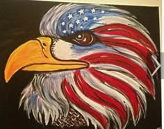 an eagle painted in red, white and blue with the american flag on it's head