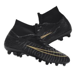 a pair of black and gold soccer shoes