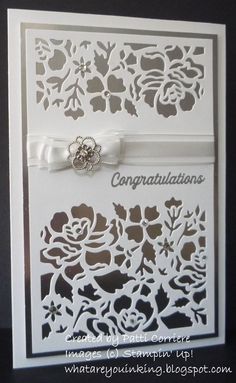 a white card with an intricate design on it