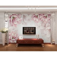 a living room with flowers on the wall