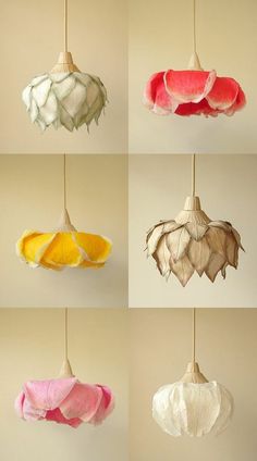 six different colored lamps hanging from strings in various shapes and sizes, each with an ornament shaped like a flower