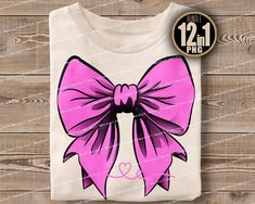 a t - shirt with a large pink bow on the front, and an image of a