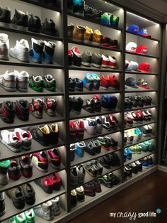 many pairs of shoes are on display in a shoe store