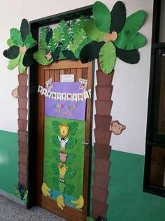 a door decorated with jungle animals and palm trees