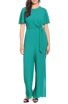 A belted waist cinches this wide-leg jumpsuit designed in flirty flutter-sleeved silhouette. 59 1/2" full length (size 4) Crew neck Short sleeves Back zip closure Lined 97% polyester, 3% spandex Machine wash, dry flat Imported Model Stats: 5'10" height; 34" bust; 27" waist; 35" hips. Model is wearing size 4. Chic Belted Green Jumpsuits And Rompers, Chic Green Belted Jumpsuits And Rompers, Chic Green Belted Jumpsuit, Belted Jumpsuit For Spring, Belted Jumpsuits And Rompers For Spring, Elegant Green Short Sleeve Jumpsuit, Elegant Flutter Sleeve Jumpsuits And Rompers For Spring, Chic Belted Short Sleeve Jumpsuits And Rompers, Chic Belted Short Sleeve Jumpsuit