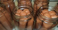 there are many jars filled with hot dogs