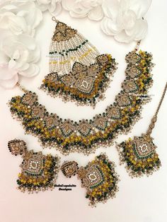 Elegant Pakistani bridal set with Jhoomer/Pakistani Jewelry/ Indian and Pakistani wedding jewelry/ Bollywood jewelry/ kundan and Polki jewelry/green yellow  This elegant necklace set comes with Earrings, tikka and Jhoomer/Passa. All items are shipped from Brampton, Ontario, Canada. If you need your item by a certain day, please reach out to us for express delivery option before placing the order so that we can update the shipping for you. Standard shipping/delivery timeline Below are the deliver Bollywood Style Green Bridal Necklace With Stone Work, Ceremonial Green Chandbali Bridal Necklace, Bollywood Green Bridal Necklace With Stone Work, Green Chandbali Bridal Sets For Festivals, Traditional Green Lehenga With Stone Work, Green Kundan Bridal Sets Chandbali, Green Kundan Bridal Sets With Chandbali Design, Green Chandbali Bridal Necklace For Ceremonial Occasion, Green Kundan Chandbali Bridal Sets