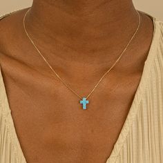 Ophelia This exquisite blue opal cross necklace is crafted with care. The dainty cross pendant, fashioned from genuine blue opal, hangs from a solid gold chain. Each opal is unique, showcasing a mesmerizing play of colors that shift and change with the light. A meaningful piece brimming with symbolism, it makes a thoughtful gift for religious occasions like baptisms or confirmations, or simply to celebrate someone born in October. - Handmade- Solid Gold- Lab-Created Opal- Charm Size: 8 x 10 mm A Born In October, Latin Word, Handmade Fine Jewelry, Solid Gold Chains, Precious Jewels, Opal Stone, Minimalistic Design, White Gift Boxes, Gold Set