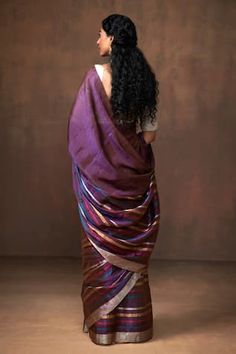 Purple handloom saree, elevated with contrast and multi color zari stripes. Comes along with unstitched blouse piece. - Aza Fashions Purple Silk Handloom Pre-draped Saree, Multicolor Slub Silk Pre-draped Saree, Multicolor Cotton Silk Pre-draped Saree, Elegant Multicolor Pre-draped Saree With Zari Weaving, Purple Cotton Silk Pre-draped Saree, Elegant Multicolor Cotton Silk Pre-draped Saree, Purple Saree With Weaving Work, Fusion Style Pre-draped Chanderi Saree, Elegant Handloom Purple Pre-draped Saree