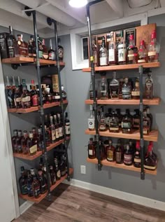 the shelves are filled with various types of liquor