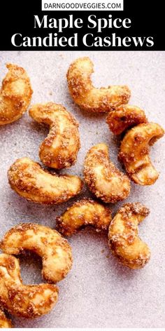 an image of some fried food on a table with the words maple spice candied cashews