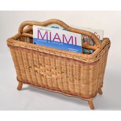 a wicker basket filled with books and magazines