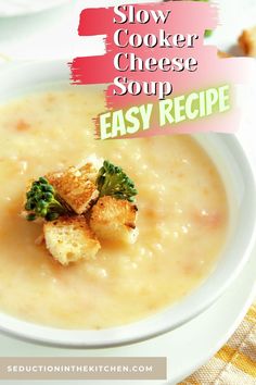 a white bowl filled with soup and croutons