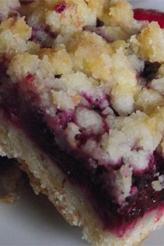 two pieces of blueberry crumb bars stacked on top of each other