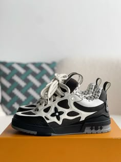 Embrace a bold and sophisticated aesthetic with these Louis Vuitton LV Skate-inspired sneakers in a timeless black and white colorway. Crafted with meticulous attention to detail, these shoes feature a unique blend of materials, including breathable mesh and luxurious leather, for a sporty and refined look. The signature Louis Vuitton monogram subtly adorns the design, adding a touch of understated luxury. Whether you're hitting the streets or the skate park, these sneakers will elevate your sty Fall Winter Jacket, Loafer Sneakers, Bottega Veneta Shoulder Bag, Skate Park, Shoe Box, The Streets, Loafer Shoes, White Sneaker, Sneaker Boots