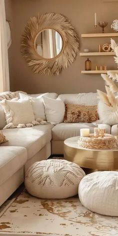 a living room filled with lots of white furniture and decor on top of a rug