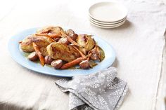 chicken and carrots on a blue plate