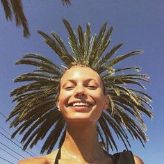 a woman with palm trees on her head