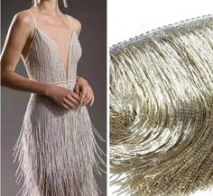 a woman in a silver dress with gold fringes on the side and an image of a