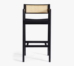 a black chair with a wicker seat and back rest on a white background,