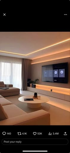 a living room filled with furniture and a flat screen tv mounted to the side of a wall