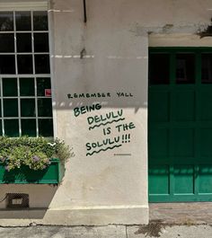 a sign on the side of a building that says being deliv is the soulu