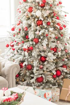 a christmas tree with red and white ornaments