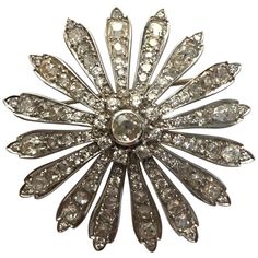 Vintage Daisy Brooch circa 1900-1930 in 18 Carat White Gold and Diamonds Brooch representing a Daisy whose Pistil is a central Diamond Set with about 0.5 carats surrounded by 8 Diamonds. Each of the 16 Petals crimping 6 Diamonds. Total Weight of old Cut Diamonds: between 8 to 9 Carats Gross Weight: 19.3 g Diameter: 4.7 cm Antique Diamond Jewelry, Vintage Daisy, Art Deco Brooch, Diamond Bows, White Gold Set, Antique Brooches, Gold Art Deco, Diamond Brooch, Crimping