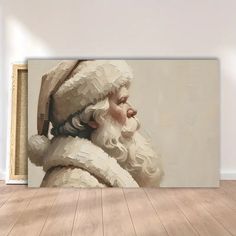 a painting of santa claus on a wall in an empty room with wooden floors and white walls