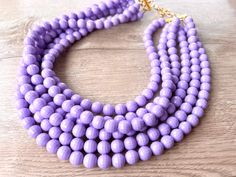 A beaded multi strand statement necklace made with faceted lavender purple lucite beads. The necklace is lightweight but chunky looking. This necklace would make a great gift or to add a little sparkle to your outfit.  - Shortest strand measures 18.5-20.5" long - 6 Strands - more are listed  - Beads measure 10mm - Gold stainless steel lobster claw (sterling silver, stainless steel, gold filled also available)  - Gold stainless steel 2" extender chain - Lead free pewter connector    The necklace Purple Statement Necklace, Acrylic Necklace, Silver Jewelry Box, Acrylic Necklaces, Necklace Chunky, Beaded Statement Necklace, Gift For Woman, Necklace Beaded, Lavender Purple