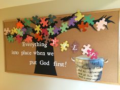 a bulletin board with puzzle pieces on it that says everything into place when we put god first