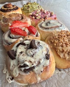 an assortment of doughnuts with different toppings