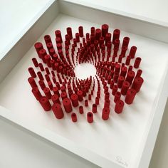 a group of red legos in a white box