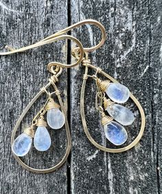 These 14k gold filled halo earrings with mini clusters of Rainbow Moonstone are petite and lovely with just enough depth and texture. The droplets of stone are small and so they are not an over bearing size. Handmade 14k gold filled earwires.  Gold filled components contain significantly more gold than similar plated items allowing for daily wear without fear of tarnishing or damaging the finish. Handmade Gold Teardrop Cluster Earrings, Cluster Earring, Ear Art, Jewelry Design Inspiration, Halo Earrings, Moonstone Earrings, Dangly Earrings, Cluster Earrings, Stunning Earrings