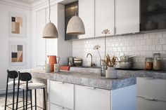 an image of a kitchen setting with white cabinets and marble counter tops on the island