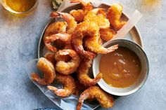 fried shrimp and dipping sauce on a plate