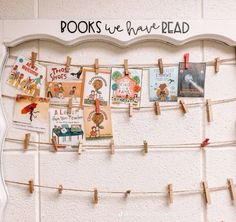 a bulletin board with clothes pins attached to it that says books we have read on them