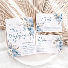 the wedding stationery is laid out on a plate with bamboo sticks in the background