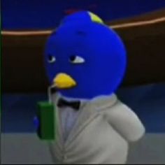 a blue bird wearing a white shirt and bow tie holding a green book in his hand