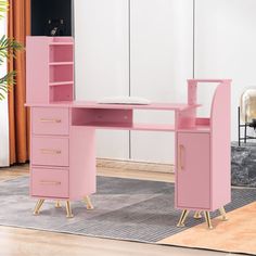 a pink desk with two drawers and a mirror in the corner next to a rug