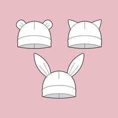 three hats with ears on them, one is white and the other has pink background