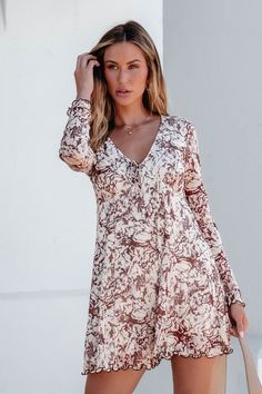 Discover the perfect combination of comfort and style with our Brown Floral Print Romper Dress! Featuring a V neckline with tie detail, this dress offers a flattering fit for any body type. The pleated wide-leg shorts and keyhole back button closure add a touch of elegance, while the lettuce-edge cuffs and hem create a trendy finish. Made with a soft and stretchy blend of 95% polyester and 5% spandex, this dress is perfect for any occasion. Style with strappy heels and a matching crossbody bag for an elevated boho chic look! Sorority Rush Outfits, Brown Floral Print, Rush Outfits, Loungewear Dresses, Gameday Dress, Floral Print Rompers, Casual White Dress, Game Dresses, Printed Rompers