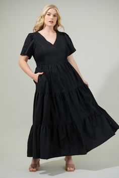 The Alexis Poplin Tiered Midi Dress is ready to make you the sweetest sight to see in any room you walk into! A tiered style shapes this lovely dress that features a smocked design on the sides and short sleeves with a v neckline. Dress is up with heels or causal with sneakers. - V-neck- Tiered- Puff sleeves- Smocked- Comes in 2 colorsSize + Fit - Model is 5'9" and wearing size 2X- Measurements taken from size 2X- Chest: 22 1/2"- Length: 58 1/2" Fabric Self:100% Cotton Lining:97% Polyester 3% Sp Tiered Ruched Cotton Midi Dress, Cotton Midi Dress With Smocked Bodice And Tiered Design, Cotton Tiered Midi Dress With Smocked Bodice, Daywear Smock Dress With Tiered Skirt, Tiered Cotton Midi Dress With Smocked Bodice, Smocked Tiered Skirt Dress For Daywear, Cotton Smock Tiered Dresses, Cotton Tiered Smock Dress, Smocked Tiered Day Dress