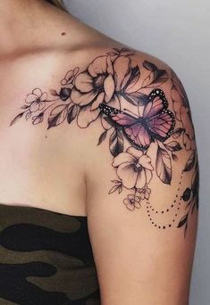 a woman with a butterfly tattoo on her shoulder